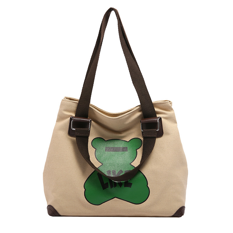 Large-capacity fashionable bags are selling well. New high-end style class bear canvas bags, student hand and shoulder tote bags for girls Item Picture