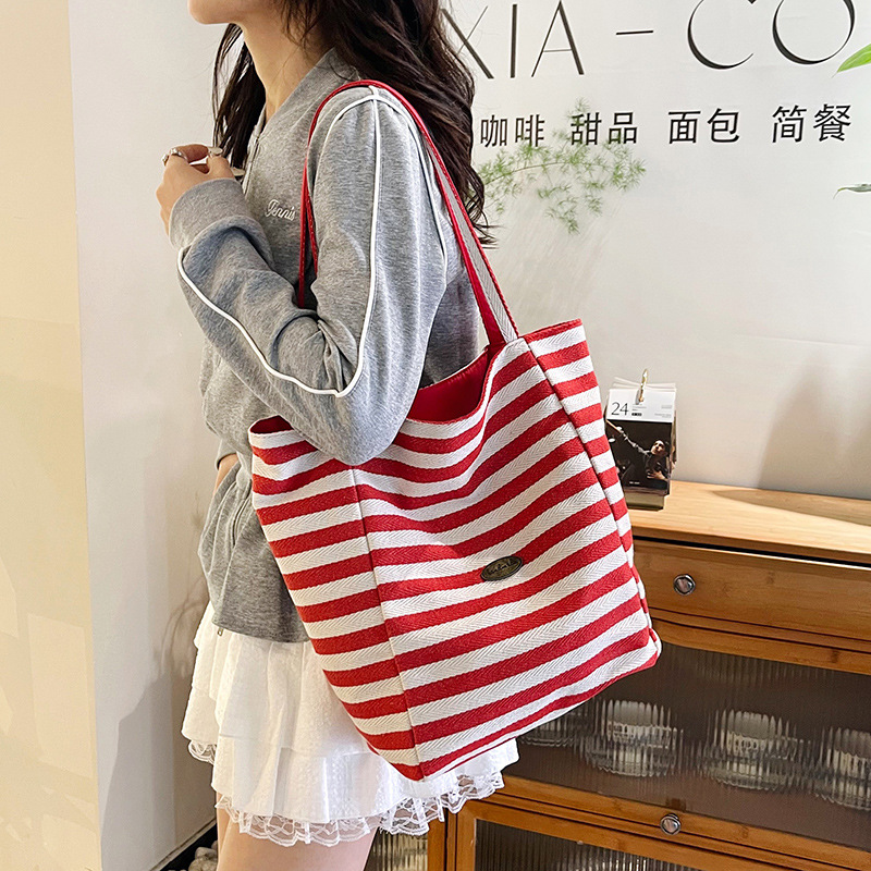 The new striped casual tote bag for cross-border foreign trade is a simple and casual shopping bag for women's elegance and a lightweight single-shoulder bag for commuting details Picture
