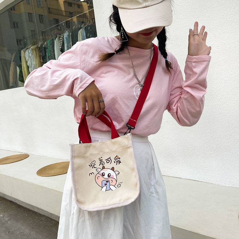 "Bag Girl 2021 New Trendy Korean style, fashionable and personalized printed single-shoulder bag for women, canvas hand-held crossbody small bag. details Picture