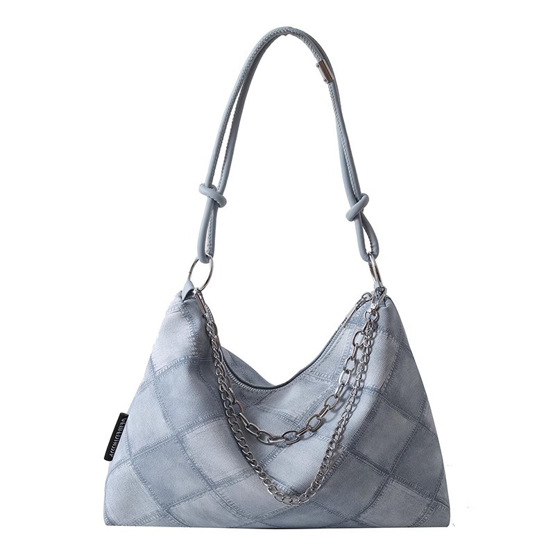 A niche canvas bag with a large capacity for women, a trendy 2023 new style for work, commuting, and student classes, a single-shoulder underarm tote bag Item Picture