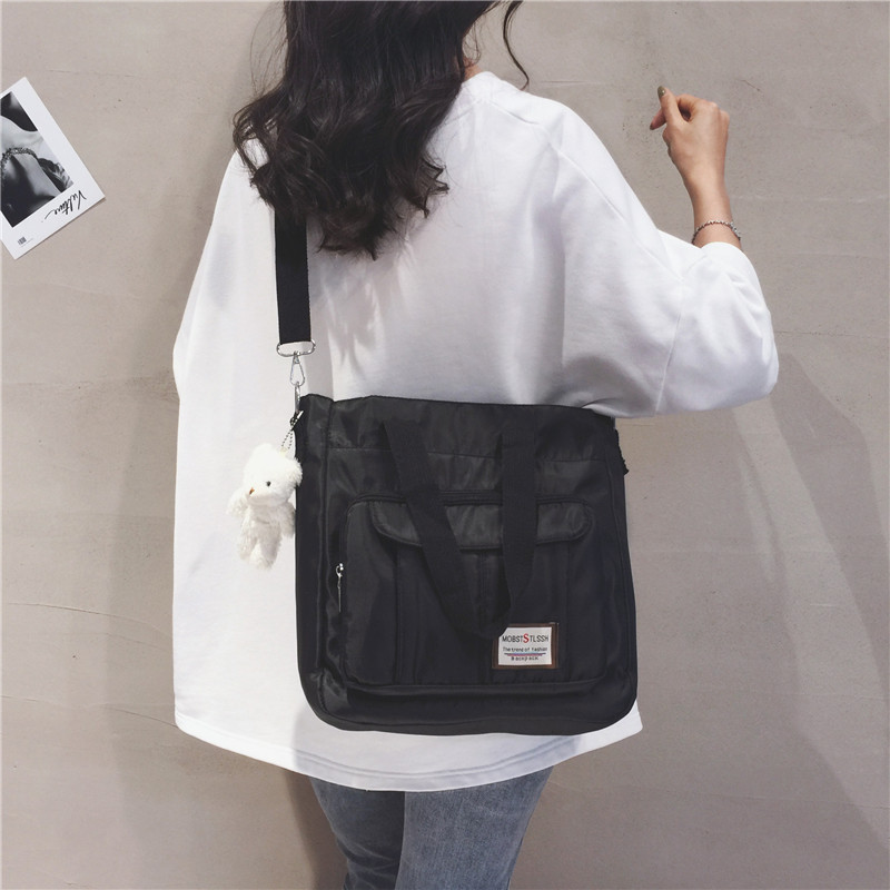 Large-capacity canvas bag for women, 2022 new trendy student lightweight hand-held class bag, casual tote bag, single-shoulder bag full figure