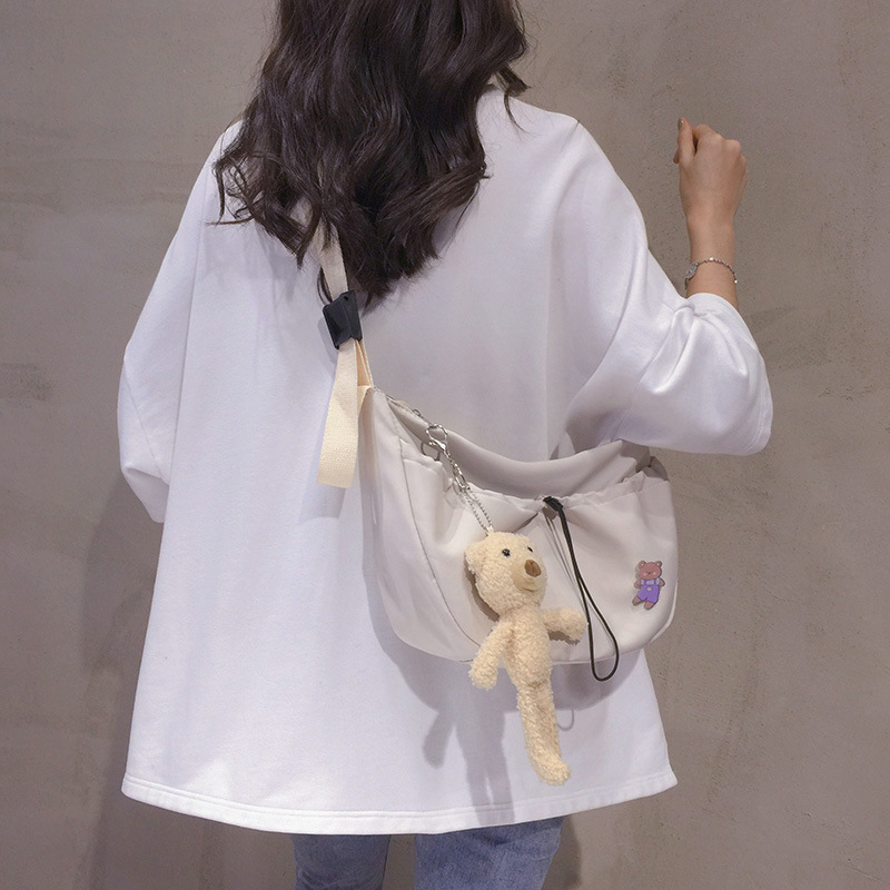 The new 2022 Little Bear canvas small bag for women is simple and versatile. The student dumpling bag is a trendy casual single-shoulder crossbody bag full figure