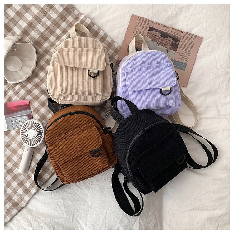 A new solid-color Japanese-style backpack for women, a Korean-style casual and versatile student schoolbag, a simple and retro trendy backpack for women full figure