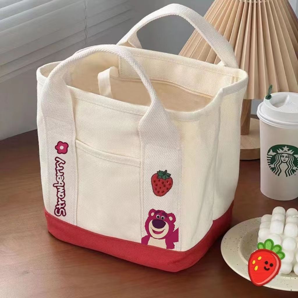 A small handbag is carried by a female student going out. She is carrying a 2024 new style bag, a mini canvas bag, and a Korean version bento bag for female students Specification drawing