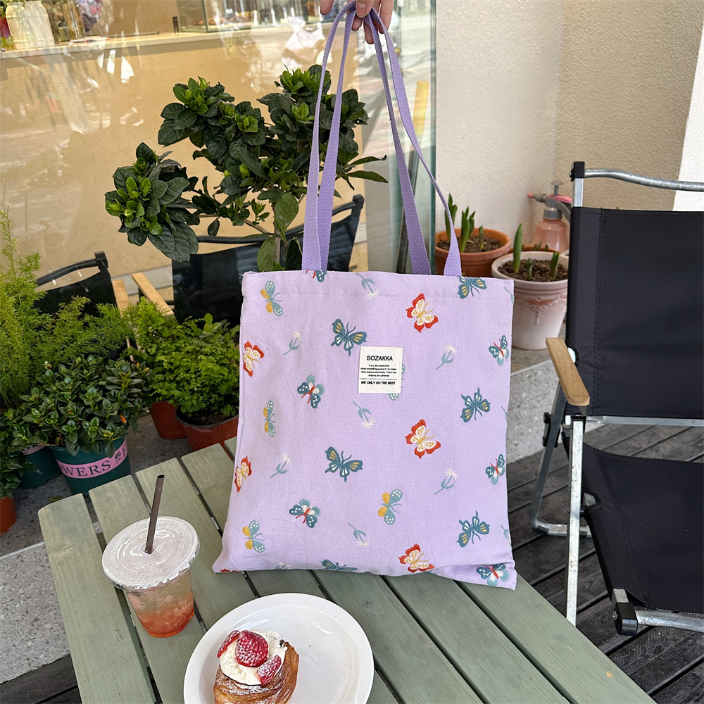 43204 Gentle sky blue embroidered butterfly canvas bag tote bag, single-shoulder handbag, casual shopping cloth bag Item Picture