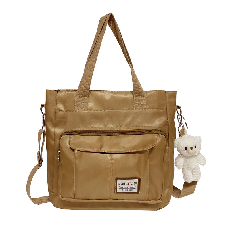 Large-capacity canvas bag for women, 2022 new trendy student lightweight hand-held class bag, casual tote bag, single-shoulder bag Item Picture