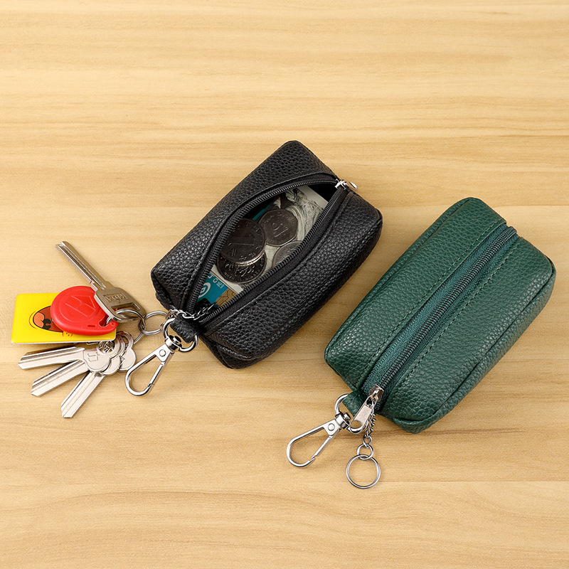 A new multi-functional lychee pattern key case in pu style from Europe and America, a mini pu coin purse with a hanging zipper full figure
