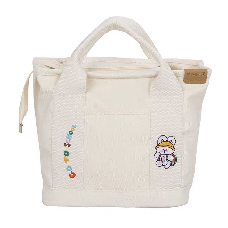 A cute Japanese-style canvas bag with dog letters, a new style for women, a handbag for moms going out, a bento bag, and a handbag for office workers Item Picture