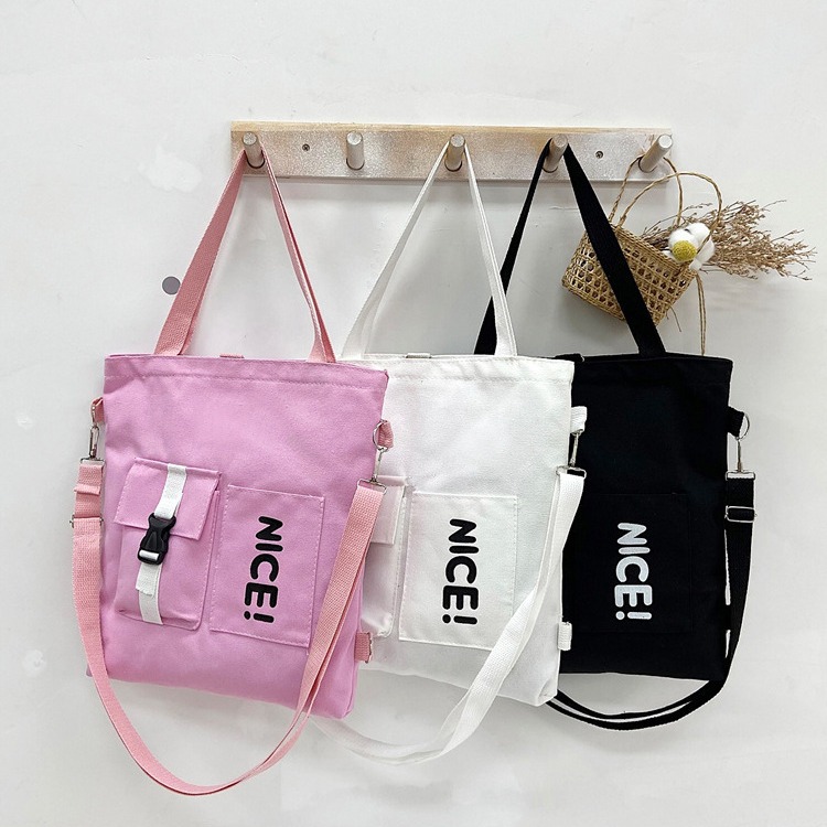 A large-capacity crossbody bag for spring 2024, featuring Japanese and Korean printed canvas for women and a student single-shoulder canvas bag with logo printing details Picture