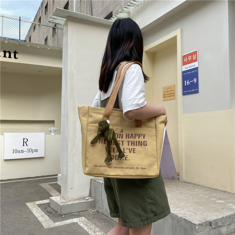 Large-capacity canvas bag for women, 2022 new style casual and laid-back school-style crossbody bag, hand-held tote bag, student schoolbag details Picture