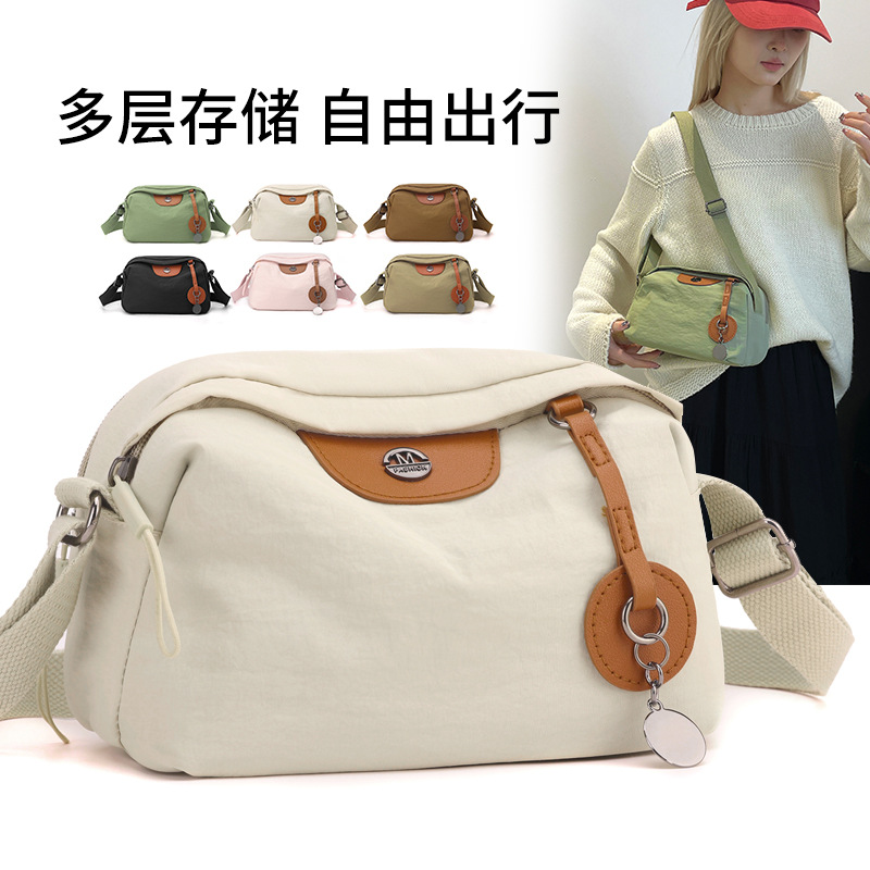The new nylon fabric crossbody bag for winter 2024 is a popular and versatile bag for women. It's a cross-border trend single-shoulder crossbody bag full figure