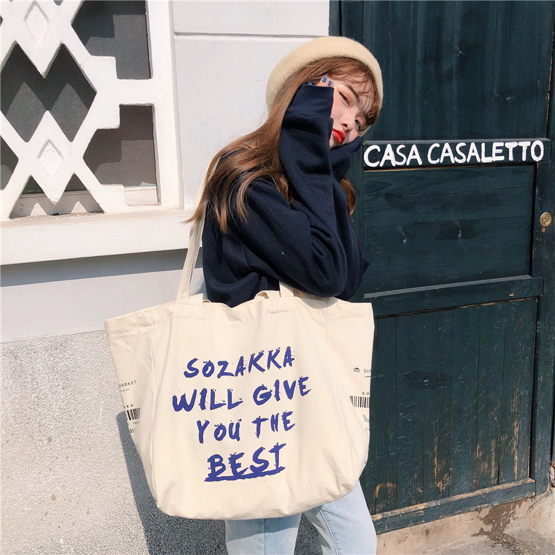 Wholesale of 91121 ins canvas bags, crossbody single-shoulder bags, large-capacity hand-held cloth bags for Japanese female students full figure