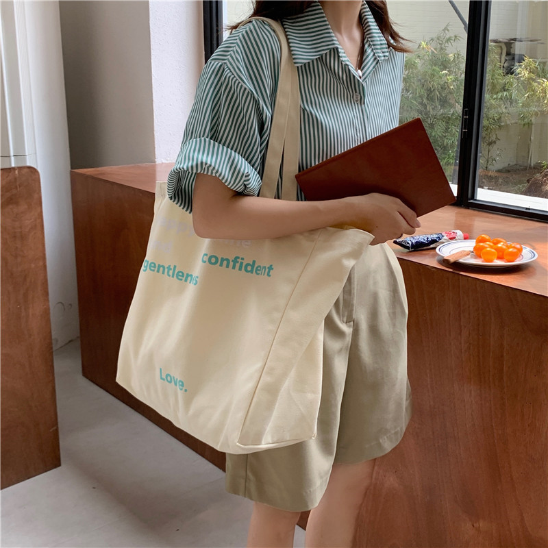 1663 New letter-printed canvas bag for female students, Korean laid-back style large capacity hand-held shoulder bag full figure