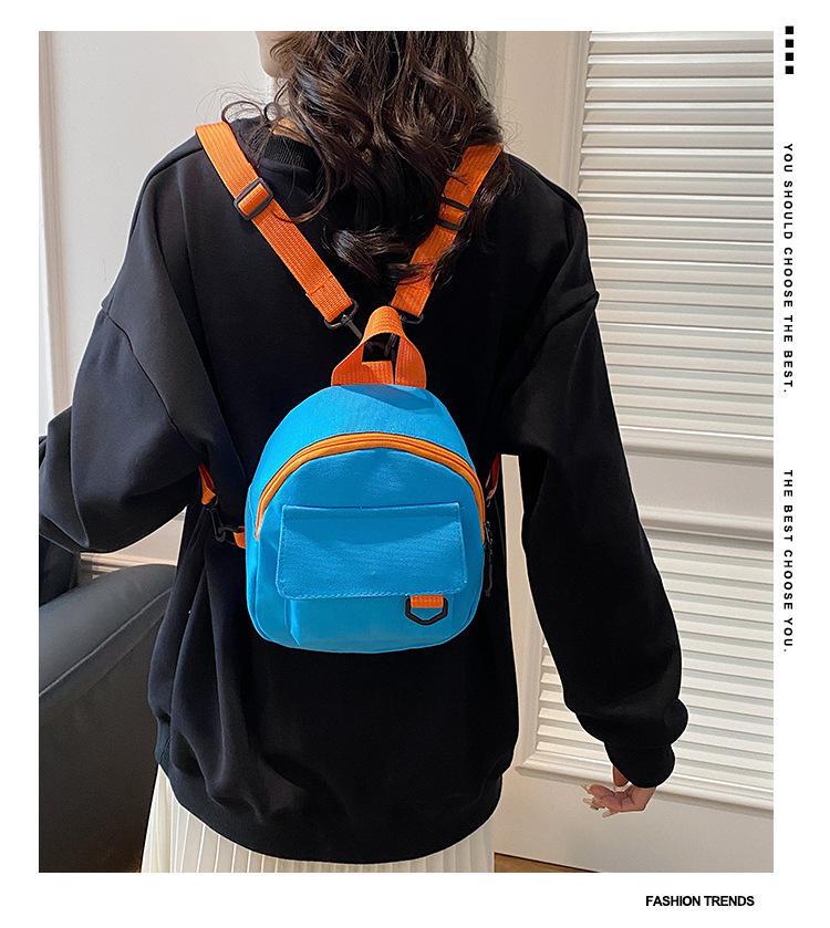 Korean-style casual, simple and retro solid-color Japanese-style canvas backpacks for women, student schoolbags, and a trend of women's commuting small backpacks full figure