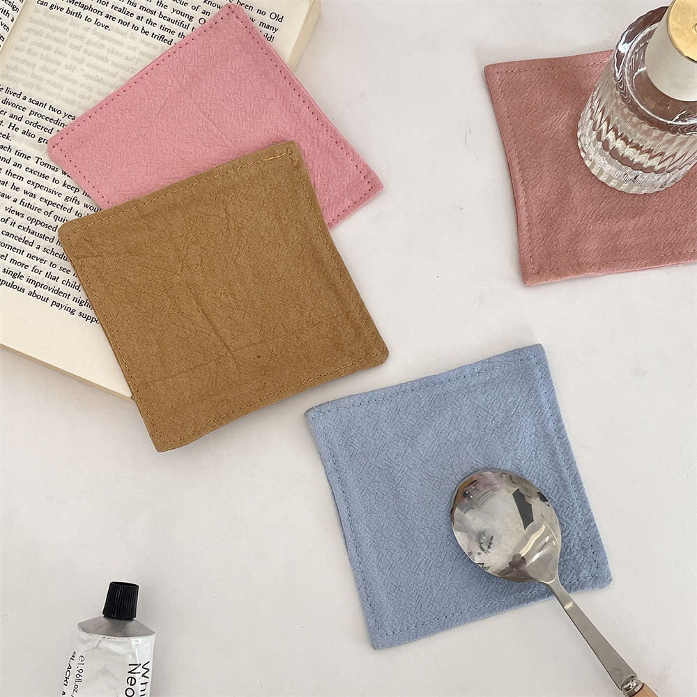 bj250223 solid color coasters, coffee shop kitchen heat insulation coasters, living room fabric atmosphere cups and water bottle coasters Application Scenario