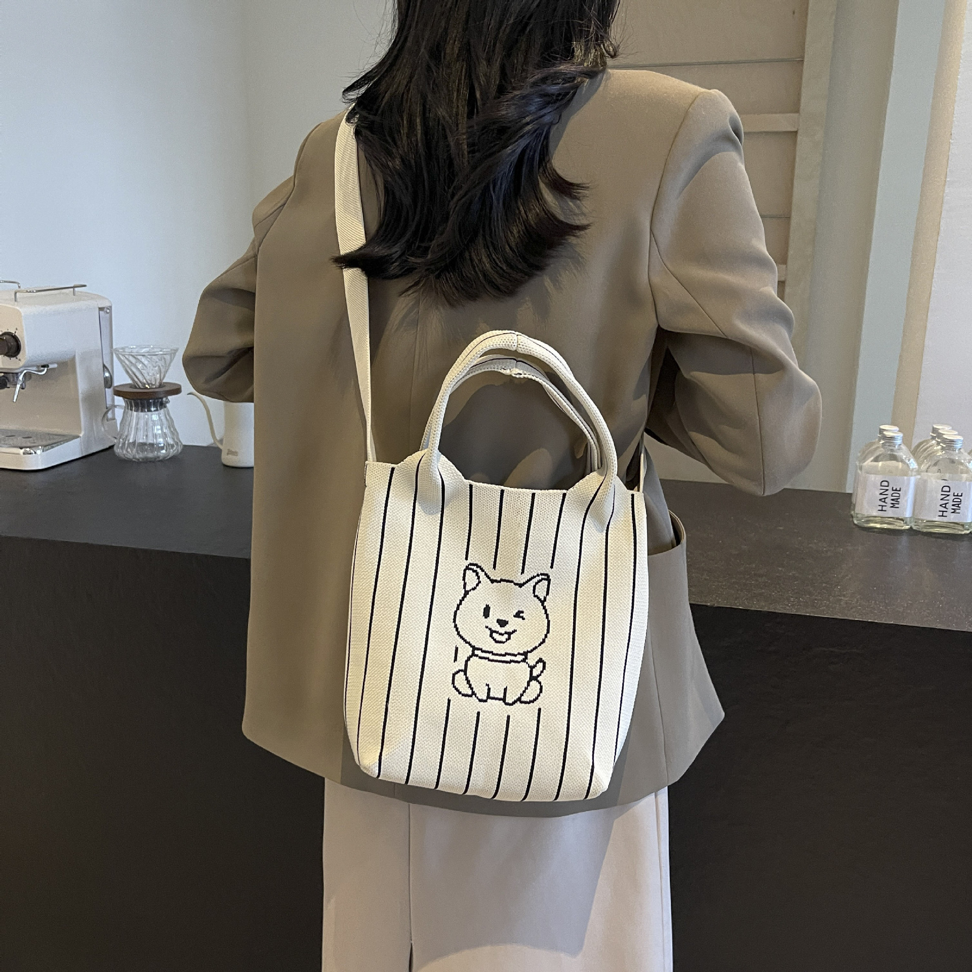 This handbag is a stylish knitted striped shopping bag. It's a popular lady's bear large-capacity tote single-shoulder bag for going out full figure