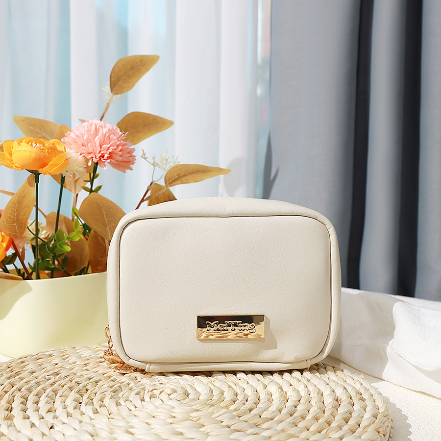 The new cosmetic bag is made of PU leather with a skin-like feel. It is a portable travel hand-held storage toiletry bag with a high appearance level and a simple design with a large capacity Item Picture