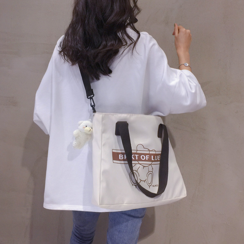 Large-capacity canvas bag for women, 2022 new trendy and versatile crossbody bag, single-shoulder commuter tote bag for college students attending classes full figure