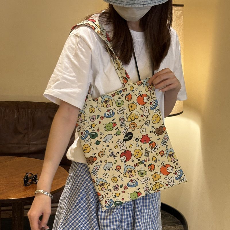 Cute cartoon 2025 new single-shoulder canvas bag, large capacity cloth bag, student tote storage, makeup bag, portable bag details Picture