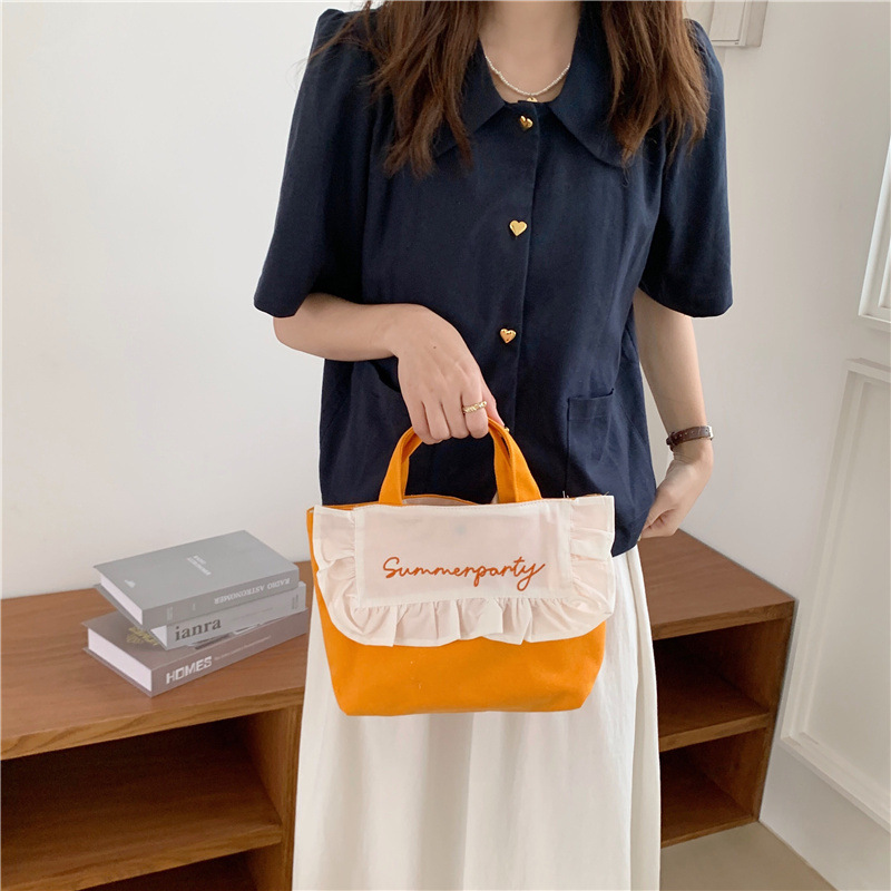 1441 Japanese and Korean chic Sweet ruffled bento Bag, Fresh embroidered hand-held small cloth bag, girl student bag wholesale Application Scenario