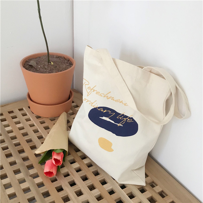 E131 canvas bag, Korean-style ins hand-held shoulder bag, color block letter graffiti shopping bag, female student's search for sources Item Picture