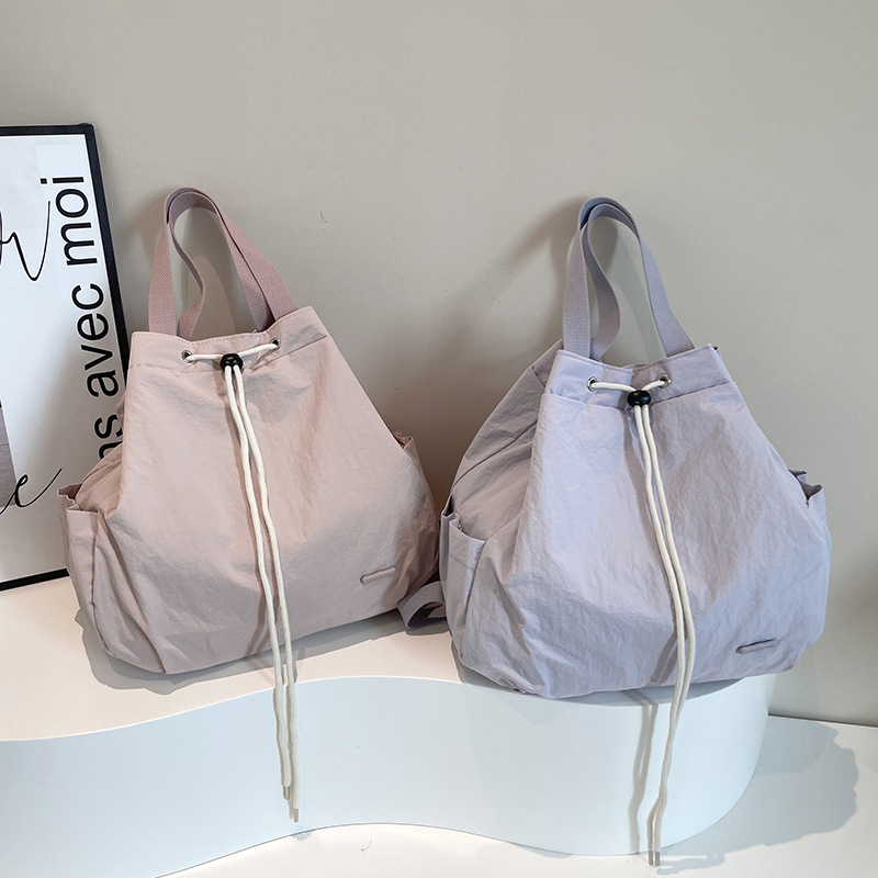 Colorful Fox Korean version women's niche drawstring backpack with large capacity nylon lightweight commuting hand shoulder Application Scenario