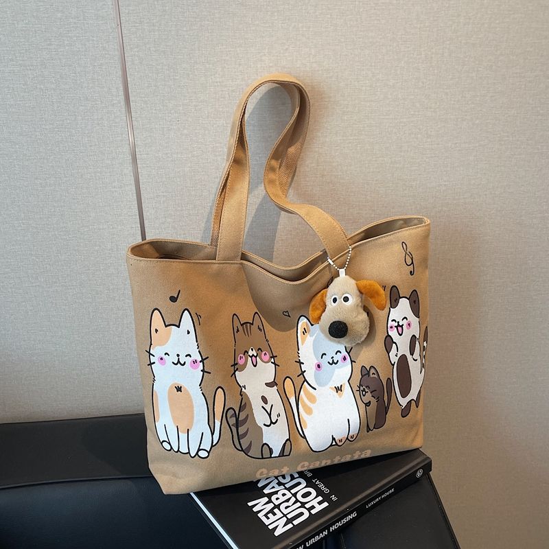 The new spring 2025 Korean-style laid-back large-capacity canvas bag for women, single-shoulder student, artistic and simple tote bag trend Application Scenario