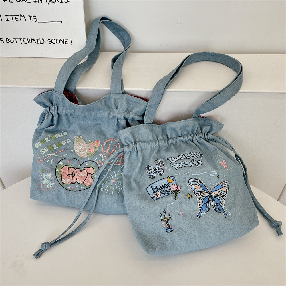 54203 2025 New bow-embroidered large-capacity denim drawstring tote bag, fashionable single-shoulder hand-carry large bag details Picture