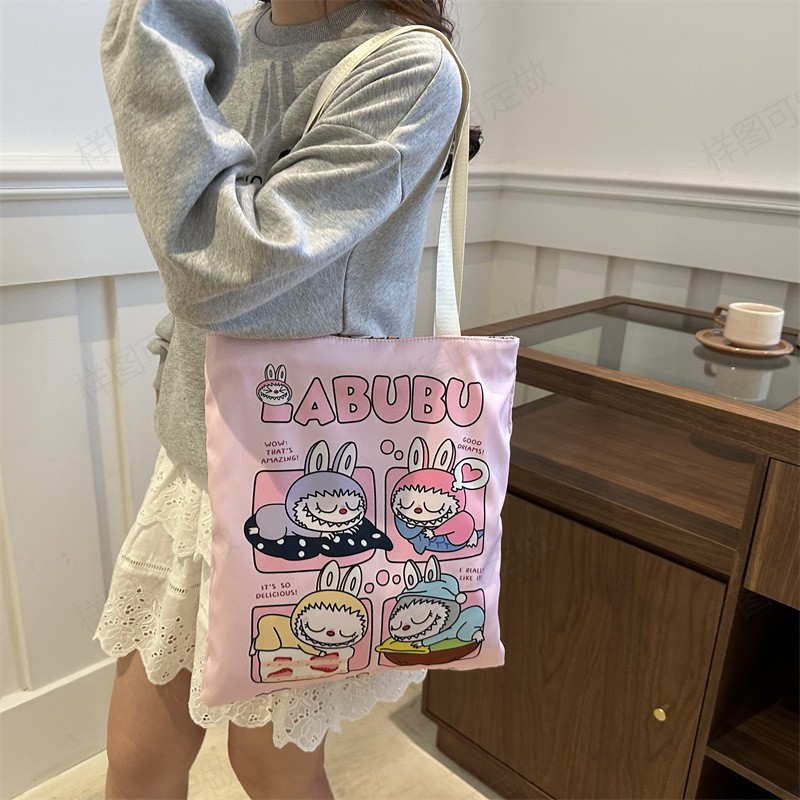 Large-capacity versatile canvas bag, cute cartoon shopping bag for girls, high appearance level student hand-held tutorial bag pattern sample Application Scenario