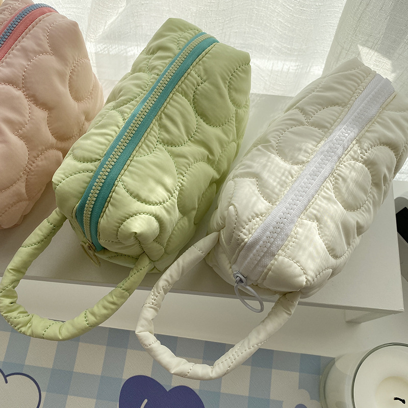 110225 Korean ins Japanese-style quilted polyester flower cosmetic bag, storage and organization bag, portable pen case for women Application Scenario