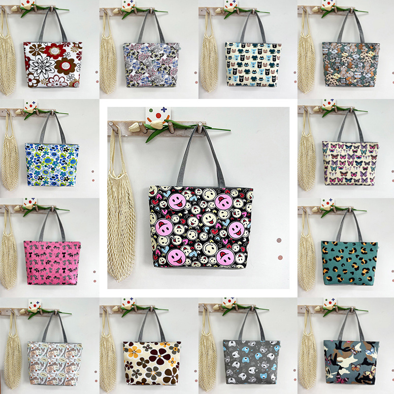 Wholesale of new casual commuting women's canvas bags, printed fashionable hand-held shoulder bags, middle-aged and elderly women's bags, and tote bags full figure