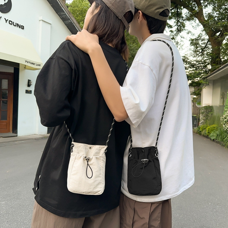 Japanese and Korean artistic single-shoulder crossbody bag, drawstring small bag, niche high-end sense, fashionable and lightweight, mini mobile phone nylon bag for women details Picture