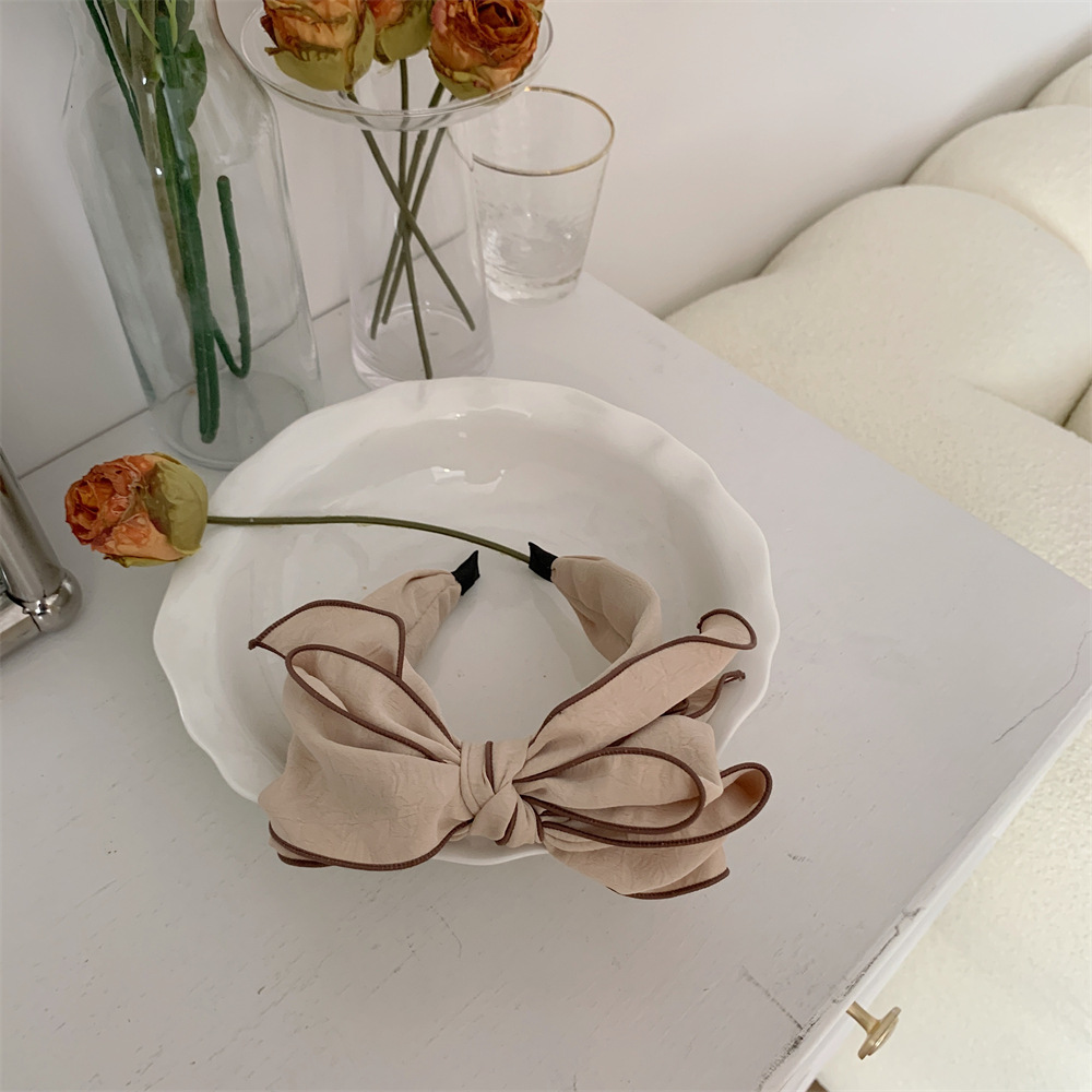 26123 Early Spring new ins three-dimensional printed plain color bow hairpin for facial slimming and facial enhancement Item Picture
