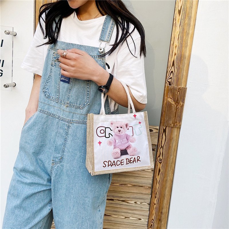 New canvas bag, a cute cartoon handbag for female students, a fresh and fashionable women's bag, and a casual hand-held small bag Specification drawing