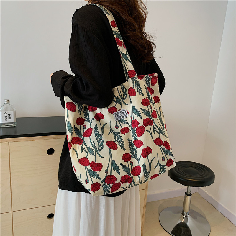The large-capacity single-shoulder bag for student commuting is a bestseller in early spring. The Korean-style fresh and simple floral fabric bag is a versatile tote bag details Picture