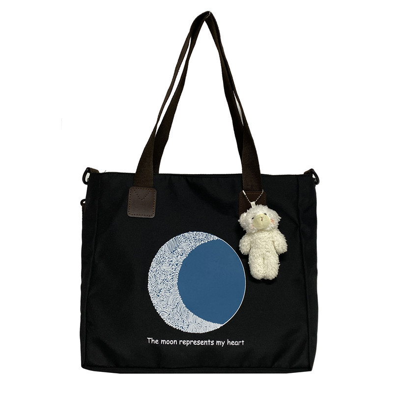 Large-capacity canvas bag for women, 2022 new trendy and versatile crossbody bag, single-shoulder commuter tote bag for college students attending classes Item Picture