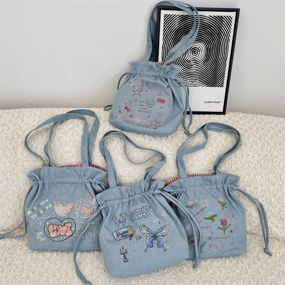 54203 2025 New bow-embroidered large-capacity denim drawstring tote bag, fashionable single-shoulder hand-carry large bag full figure