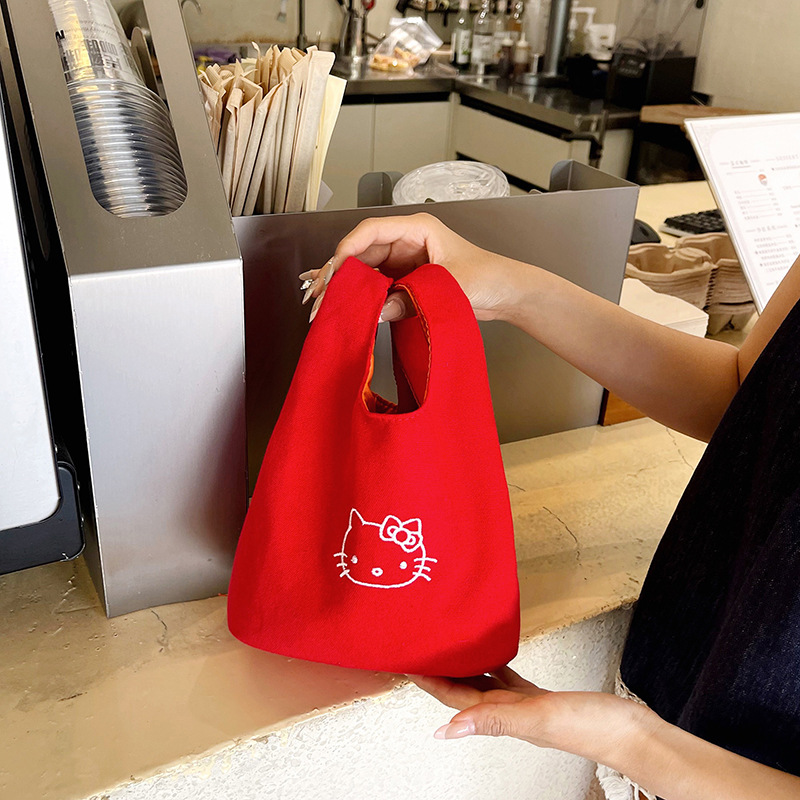 2025 New canvas handbag, a popular female cartoon bucket bag, versatile for Japan and South Korea, and an ins hand-held tote lunch box bag full figure