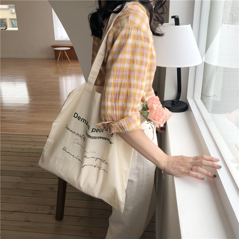E98 French Demain Korean version single-shoulder bag, hand-held canvas bag, street style shopping bag, student bag, female trend full figure