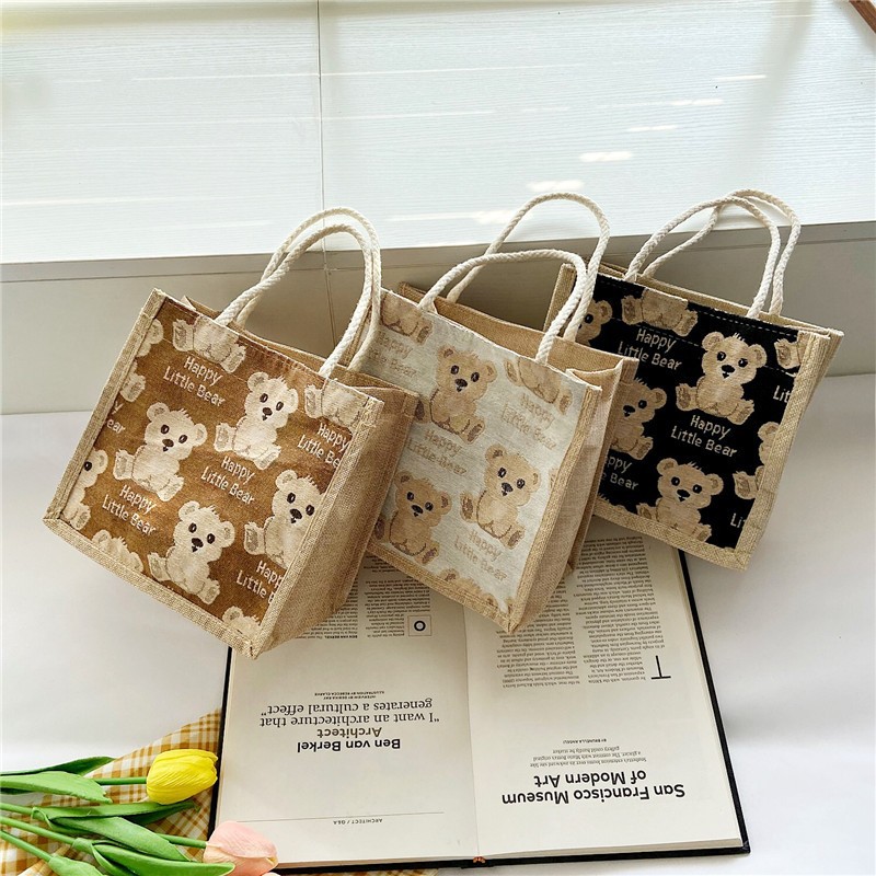 Cute hand-held linen bag 2022 new style women's bag, hand-held bento bag, simple lunch bag for office workers with rice full figure