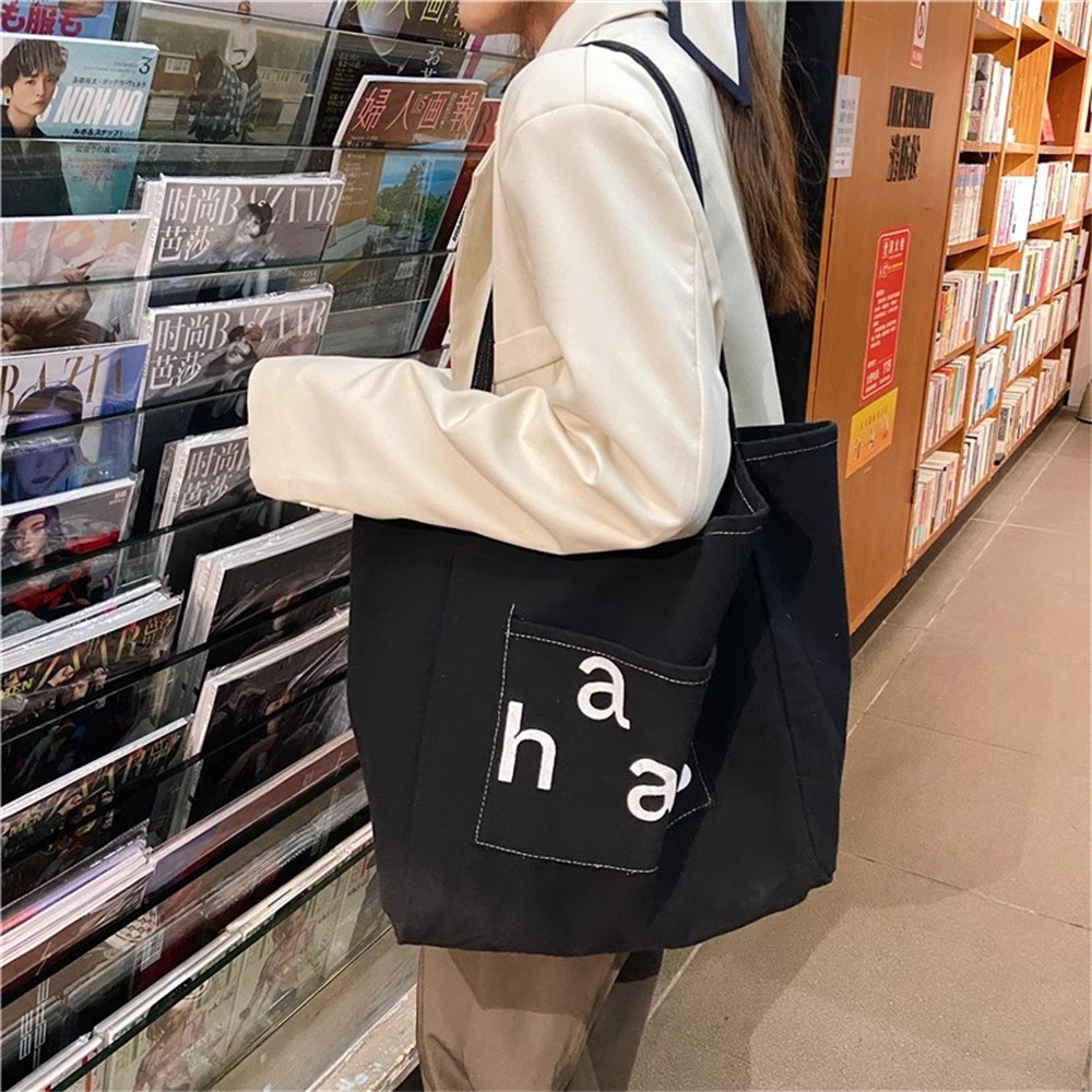 13313 New simple canvas letter Korean-style commuter tote bag, large-capacity single-shoulder bag, casual and fashionable women's bag Application Scenario