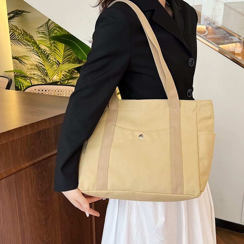 Wholesale of new women's single-shoulder bags, cross-border simple and casual canvas bags, Korean version LOGO printed commuter tote bags full figure