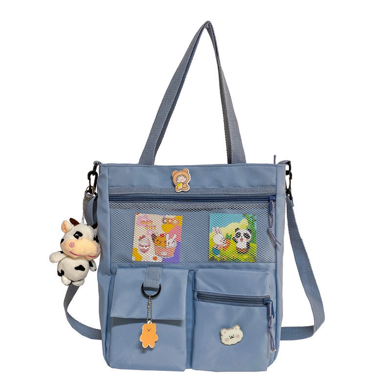 Large-capacity Japanese-style single-shoulder canvas bag for girls, versatile crossbody, ins, a tote bag for junior high school students' classes, and a schoolbag for after-school tutoring Item Picture