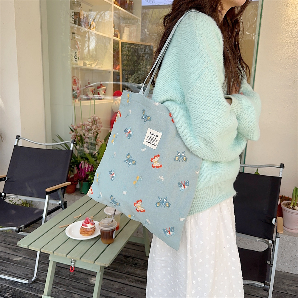 43204 Gentle sky blue embroidered butterfly canvas bag tote bag, single-shoulder handbag, casual shopping cloth bag details Picture