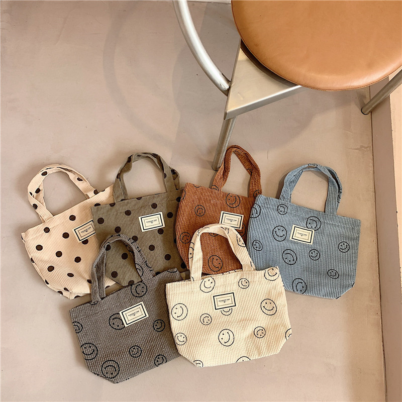 112221 New corduroy retro polka dot handbag, Japanese-style cute smiling face tote bag, women's bento bag details Picture