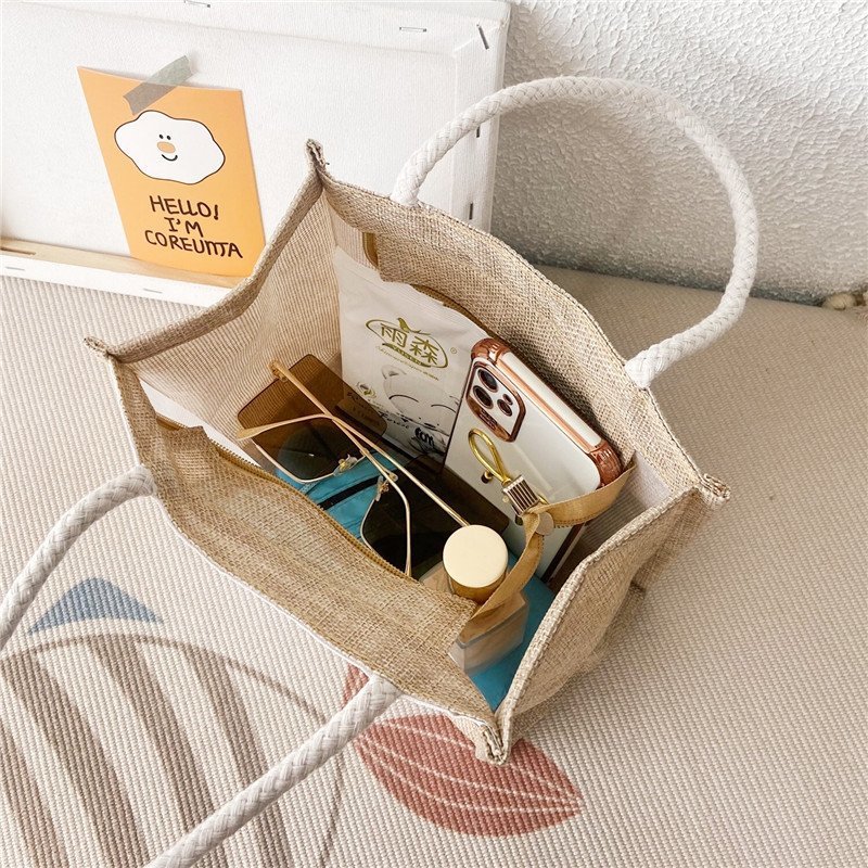 New canvas bag, a cute cartoon handbag for female students, a fresh and fashionable women's bag, and a casual hand-held small bag Application Scenario