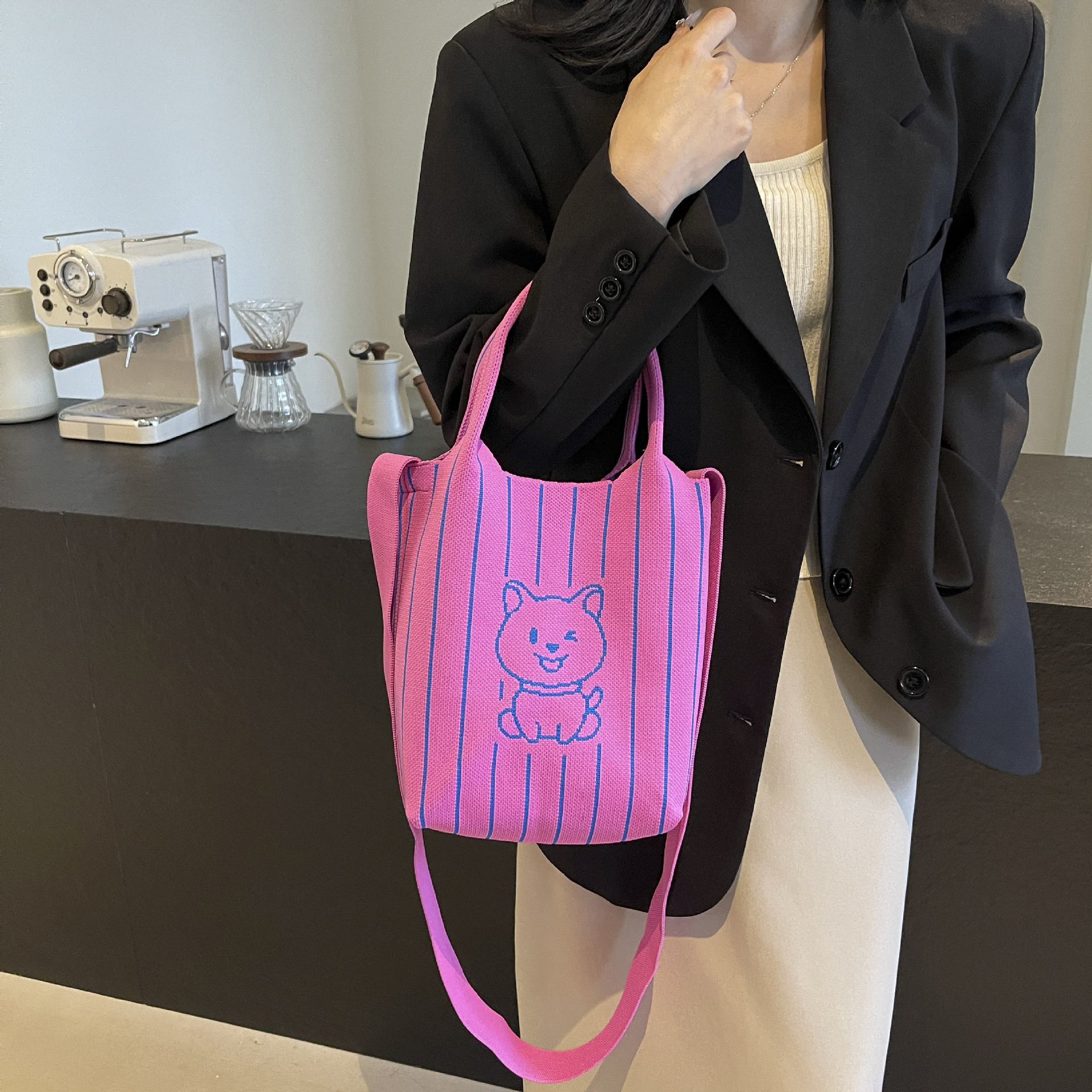 This handbag is a stylish knitted striped shopping bag. It's a popular lady's bear large-capacity tote single-shoulder bag for going out Application Scenario