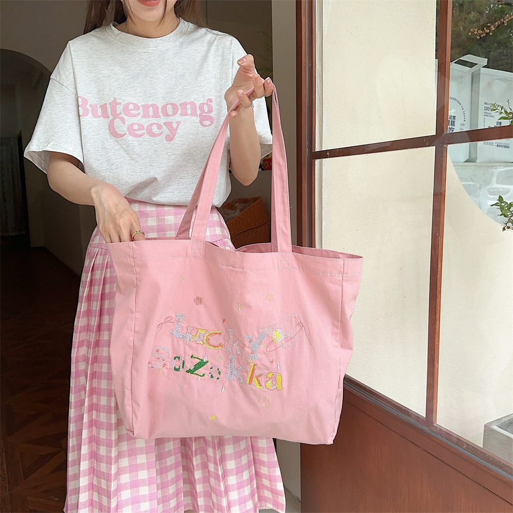 4591 Summer canvas embroidery casual and laid-back style ins Artistic hand-held single-shoulder bag shopping bag Canvas schoolbag Application Scenario