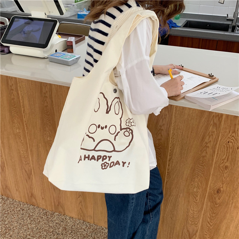 1961 Korean cartoon printed single-shoulder bag, simple Japanese student cute tote bag, large capacity canvas bag for women Application Scenario