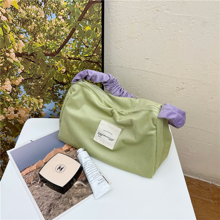 Cute color-blocking corduroy handbag, large-capacity girlish portable storage bag, large-capacity makeup bag for girls Application Scenario